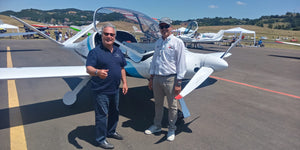 Trike Pilots' Customized Polo shirt sported by Michael Hall founder of Planes & Sails while chatting with Porto Aviation's CEO Alberto, the creator of the twice  World Record setter Risen with which he crossed the Atlantic via Brazil. 