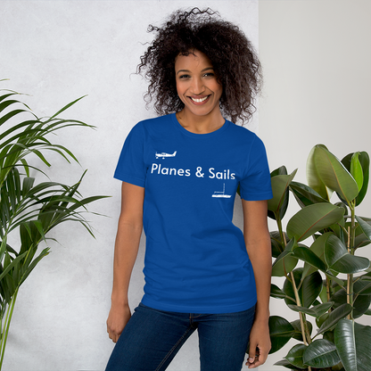 Pilots and mariners clothing: On a royal blue coloured tee shirt a white low wing single engine plane is printed on the right breast whereas there is a sailing boat below the left breast with the phrase planes and sails written inbetween the two.