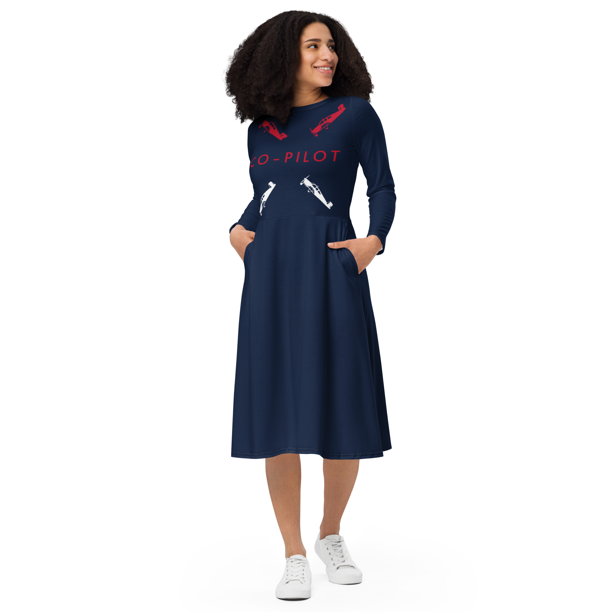 ladies long sleeve midi cut dress in navy blue with designs of two red Beechcraft Bonanza planes and two white planes  chasing each other from shoulder to waist with Co-Pilot written in red letters separating them and running from the right to the left breast.