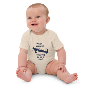 Baby Pilots wear: Organic cotton baby's bodysuit with an image of a navy blue single prop low wing aircraft surrounded by a sentence that says "when I grow up I'm going to be a pilot!"