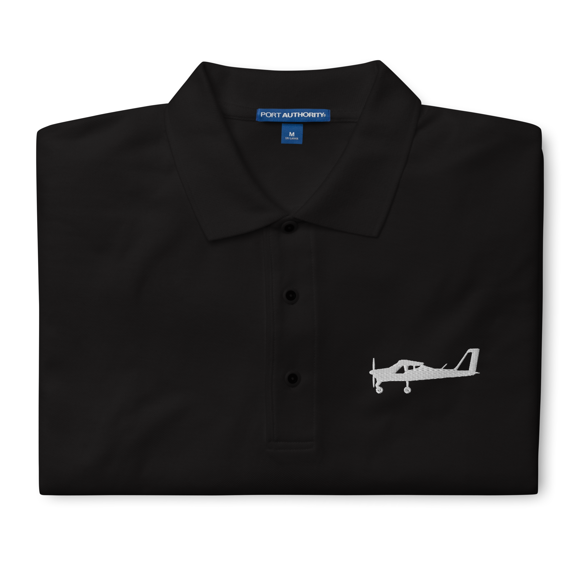 White Tecnam P92 aircraft embroidered design placed on the left breast of a black polo shirt