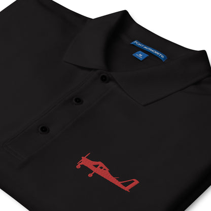 Red Tecnam P92 aircraft embroidered design placed on the left breast of a black colour polo shirt.