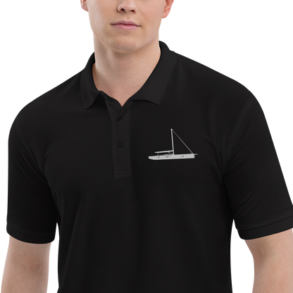 Sailing apparel: Black polo shirt depicting a white embroidered sailing boat placed over the left breast.