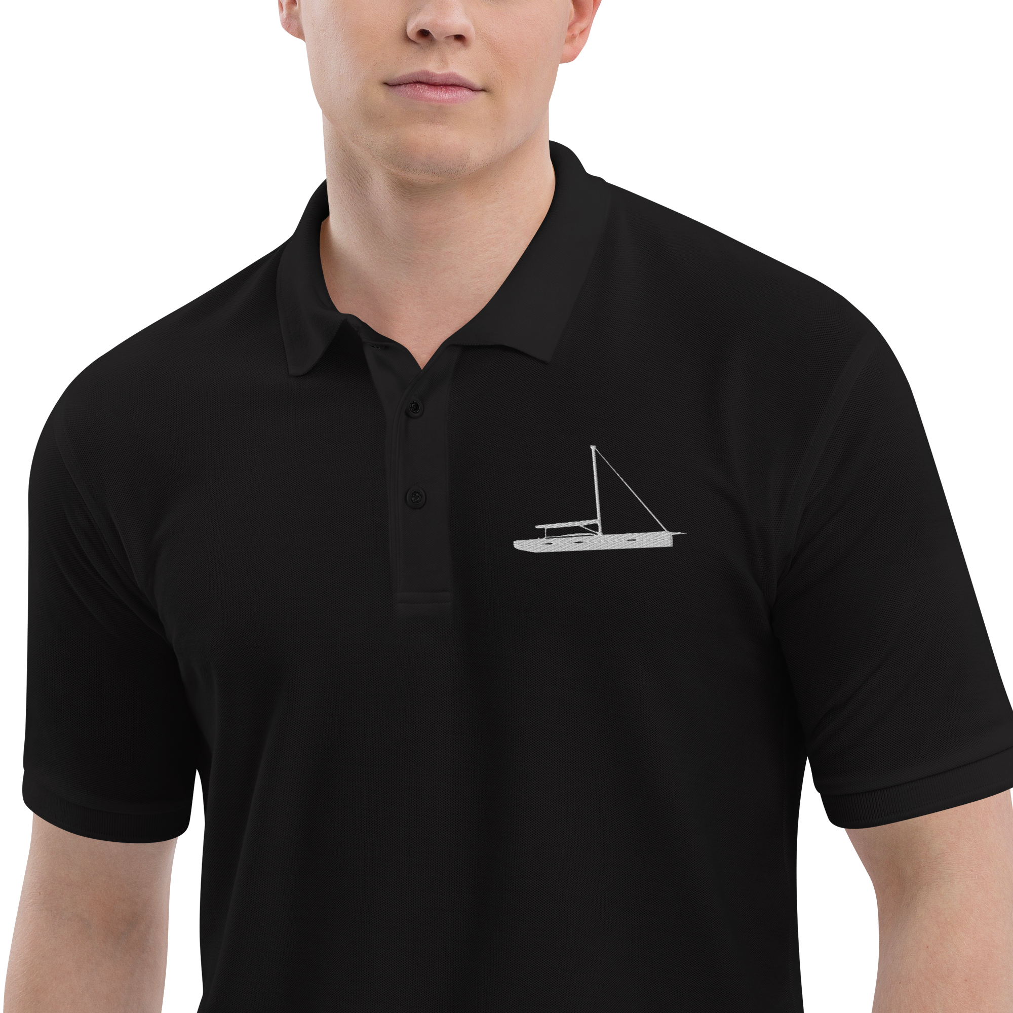 Sailing apparel: Black polo shirt depicting a white embroidered sailing boat placed over the left breast.