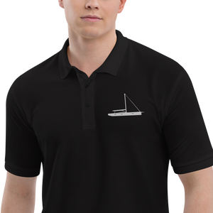 Sailing apparel: Black polo shirt depicting a white embroidered sailing boat placed over the left breast.