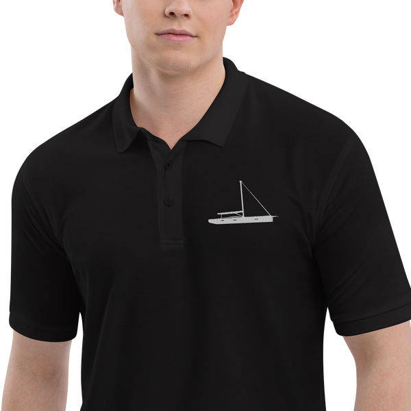 Sailing apparel: Black polo shirt depicting a white embroidered sailing boat placed over the left breast.