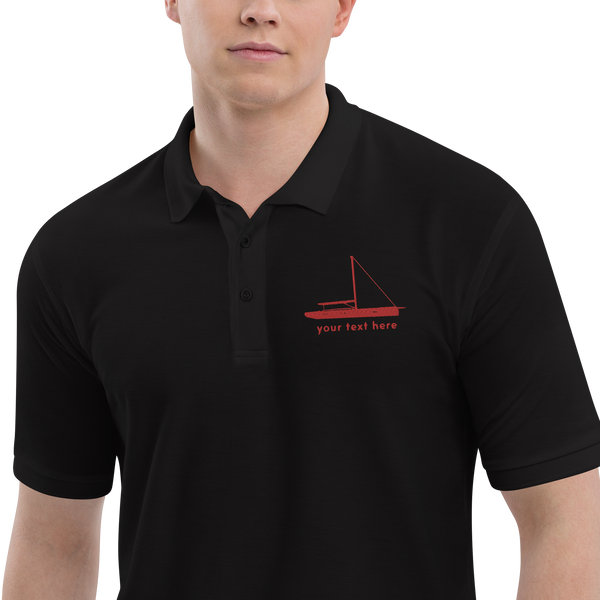 Sailing apparel: Black polo shirt with a red sloop rigged sailing boat placed over the left breast.