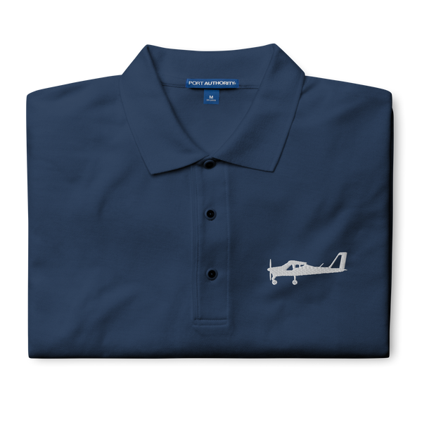 White Tecnam P92 aircraft embroidered design placed on the left breast of a navyblue polo shirt