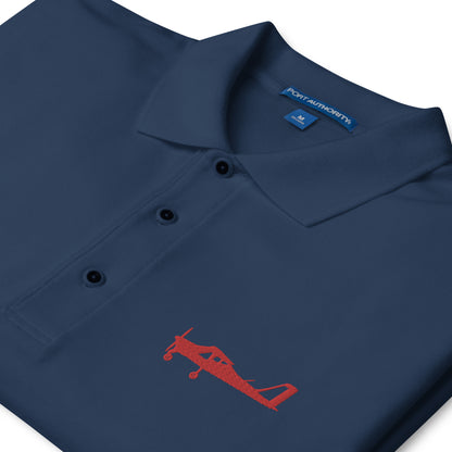 Red Tecnam P92 aircraft embroidered design placed on the left breast of a navy blue colour polo shirt.