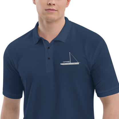 Sailing apparel: Navy blue polo shirt depicting a white embroidered sailing boat placed over the left breast.