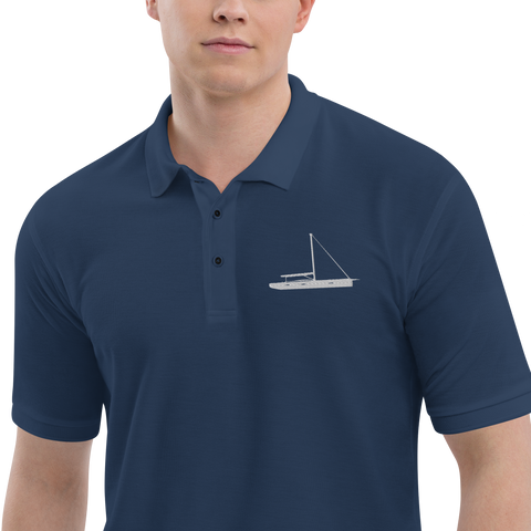 Sailing apparel: Navy blue polo shirt depicting a white embroidered sailing boat placed over the left breast.