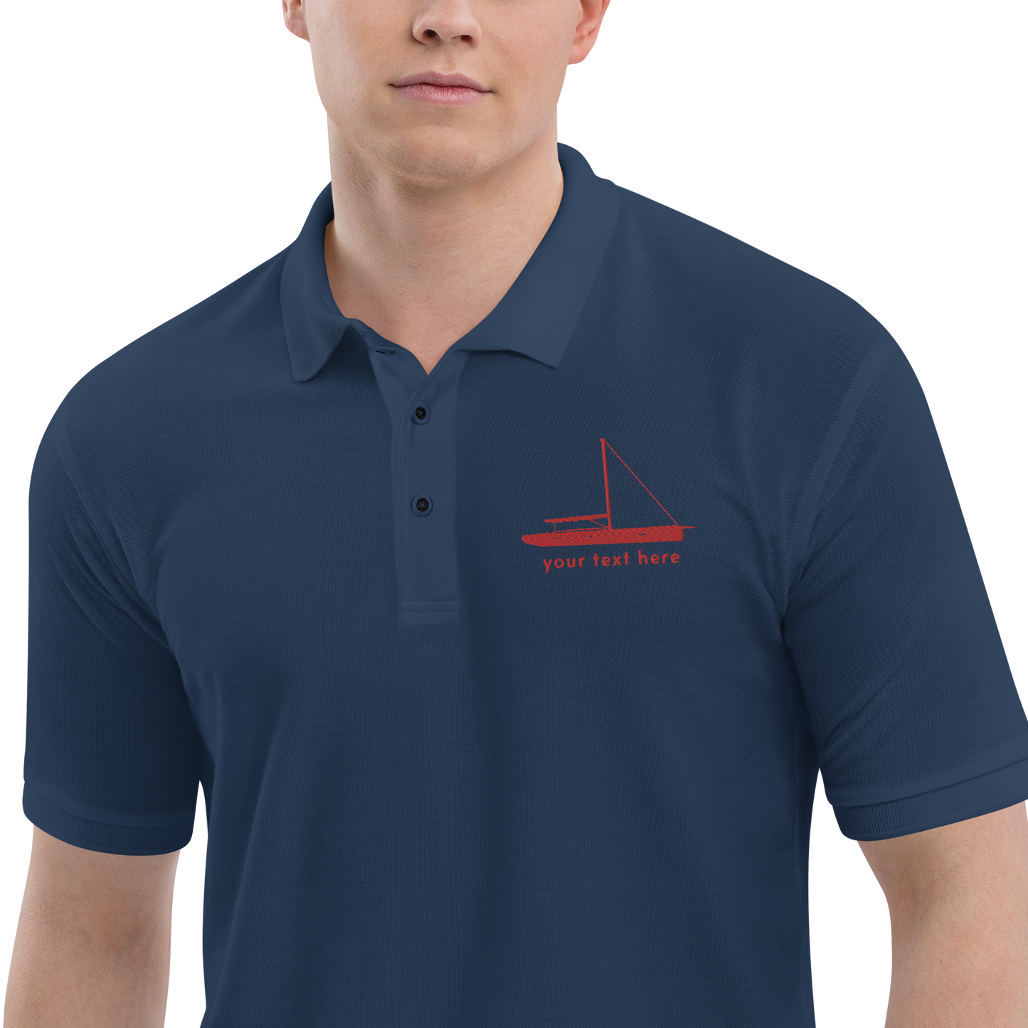 Sailing apparel: Navy blue polo shirt with a red sloop rigged sailing boat placed over the left breast.