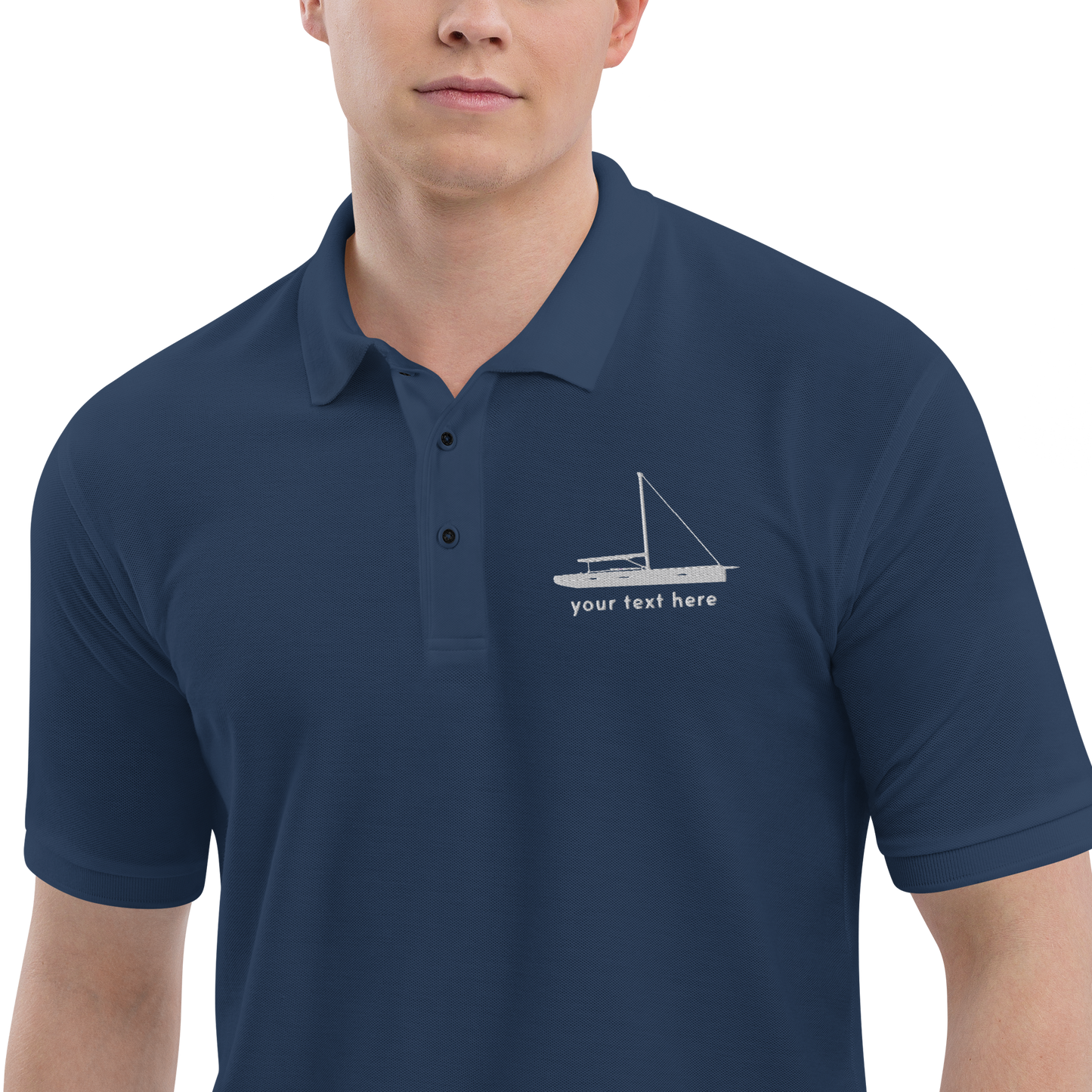 Sailing apparel: Navy blue polo shirt with a white sloop rigged sailing boat placed over the left breast.