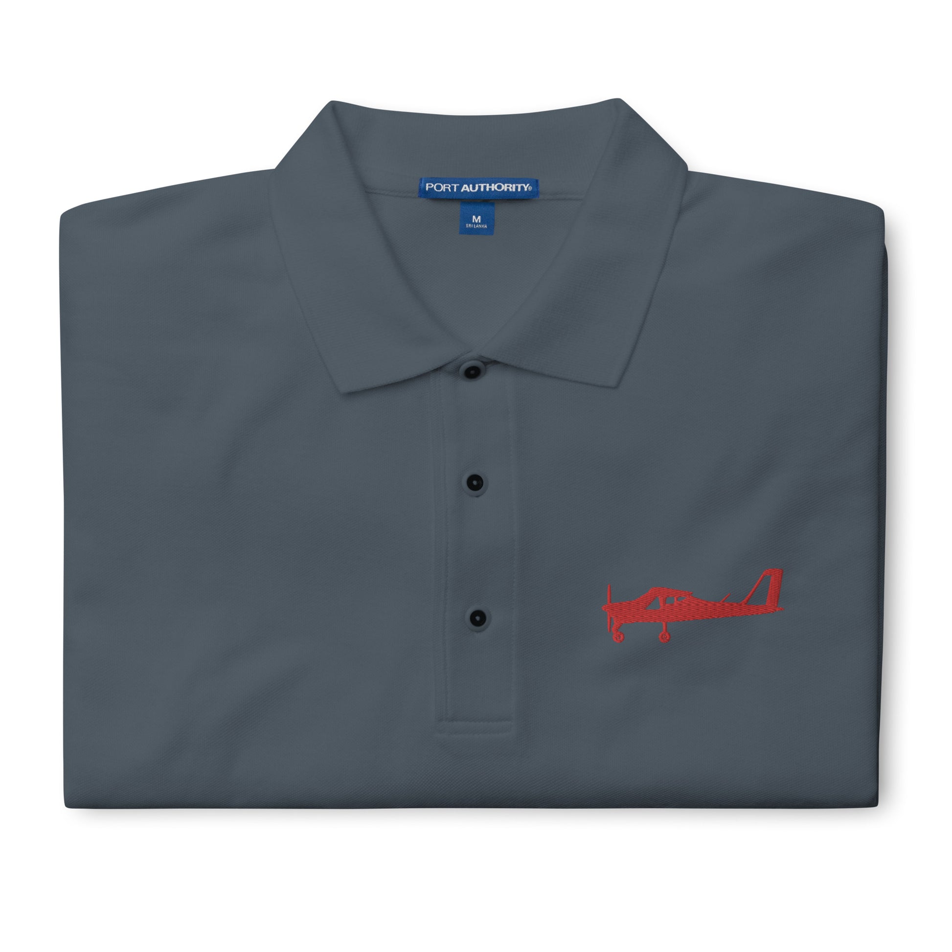 Red Tecnam P92 aircraft embroidered design placed on the left breast of a grey colour polo shirt.