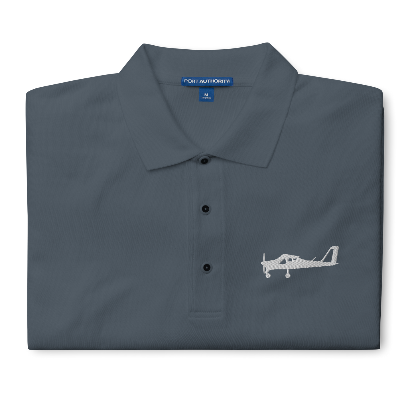 White Tecnam P92 aircraft embroidered design placed on the left breast of a dark grey polo shirt