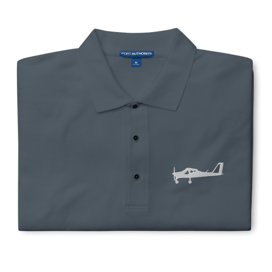 White Tecnam P92 aircraft embroidered design placed on the left breast of a dark grey polo shirt