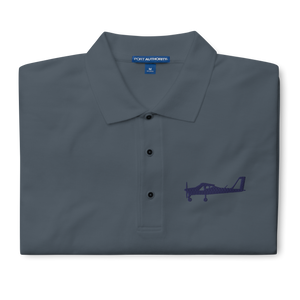 Navy blue Tecnam P92 aircraft embroidered design placed on the left breast of a dark grey polo shirt.