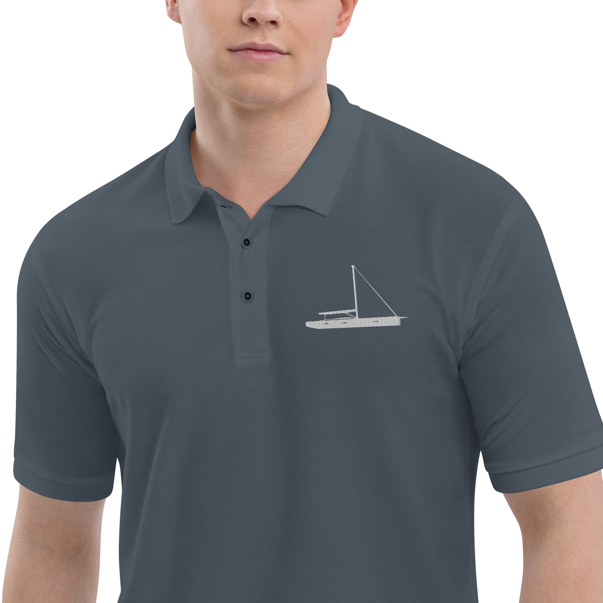 Sailing apparel: Asphalt grey polo shirt depicting a white embroidered sailing boat placed over the left breast.