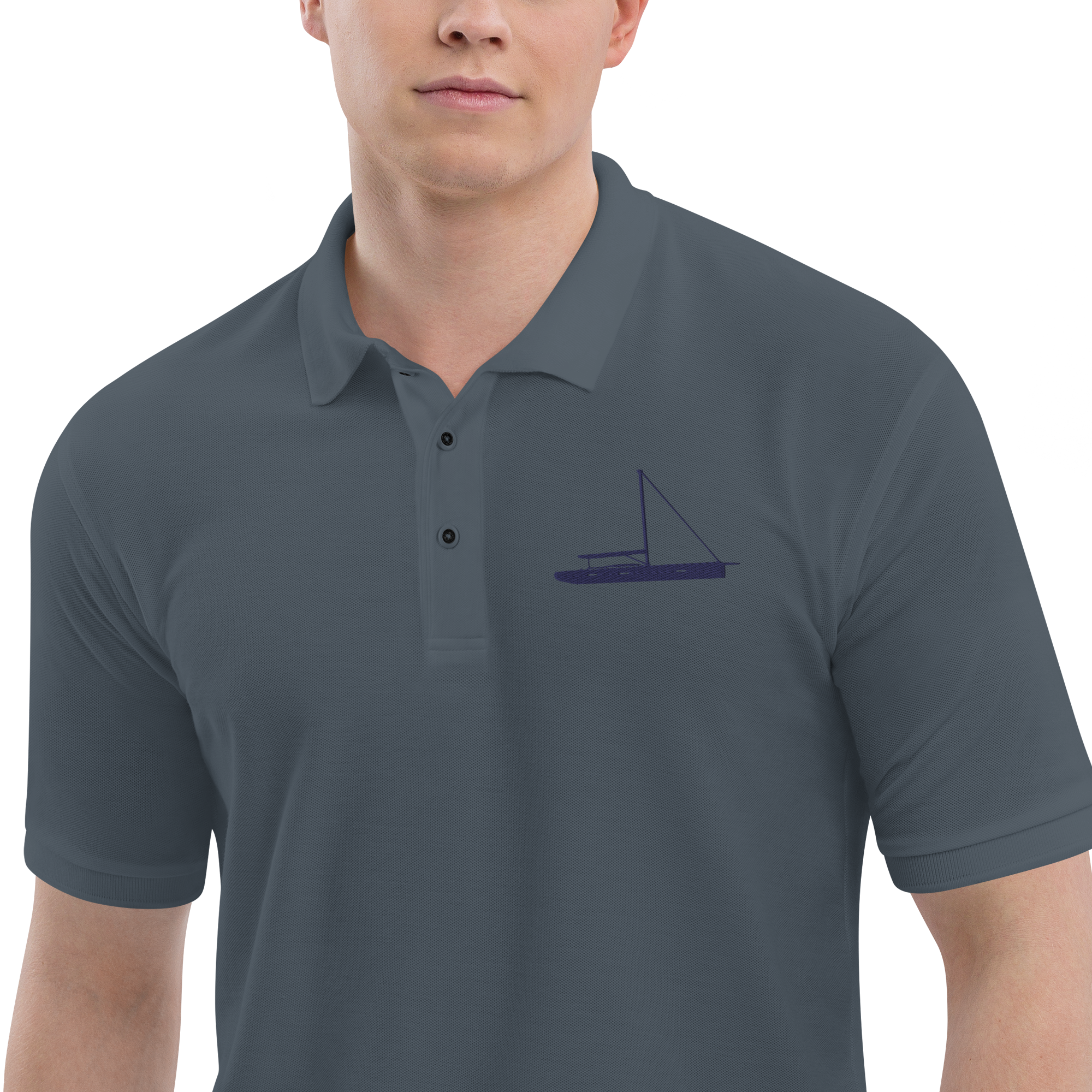 Sailing apparel: Asphalt grey polo shirt  with a navy blue sloop rigged sailing boat.