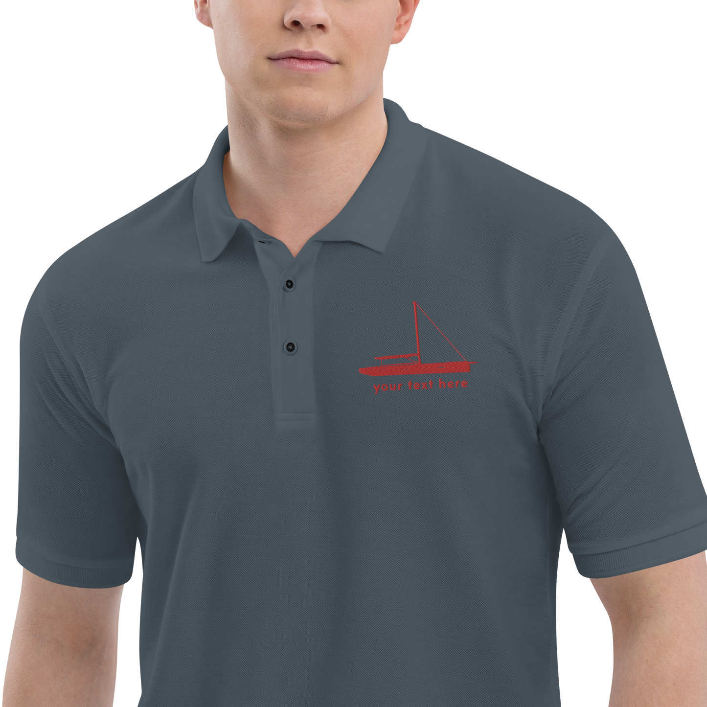 Sailing apparel: Asphalt grey polo shirt with a red sloop rigged sailing boat placed over the left breast.