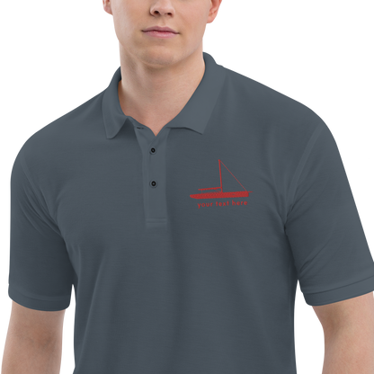 Sailing apparel: Asphalt grey polo shirt with a red sloop rigged sailing boat placed over the left breast.