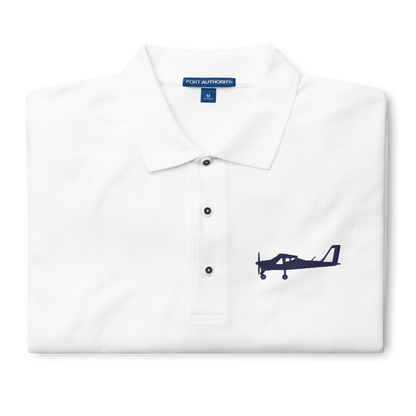 Navy blue Tecnam P92 aircraft embroidered design placed on the left breast of a white colour polo shirt.