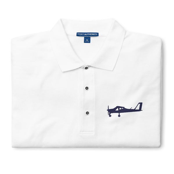 Navy blue Tecnam P92 aircraft embroidered design placed on the left breast of a white colour polo shirt.