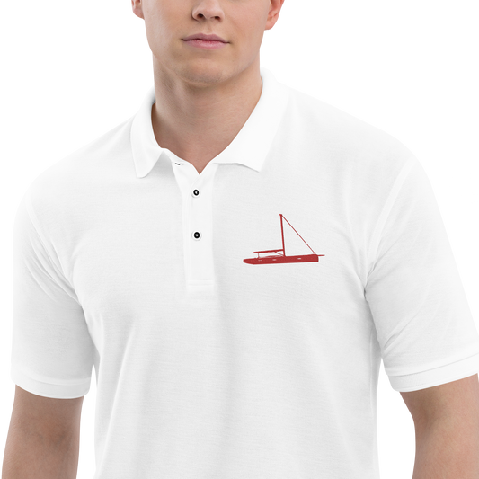 Sailing apparel: White polo shirt depicting a red sailing boat placed over the left breast.