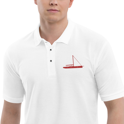 Sailing apparel: White polo shirt depicting a red sailing boat placed over the left breast.