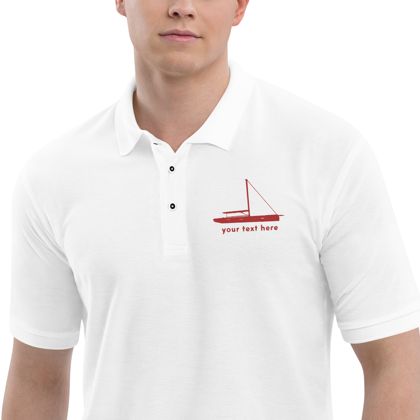 Sailing apparel: White polo shirt with a red sloop rigged sailing boat placed over the left breast.