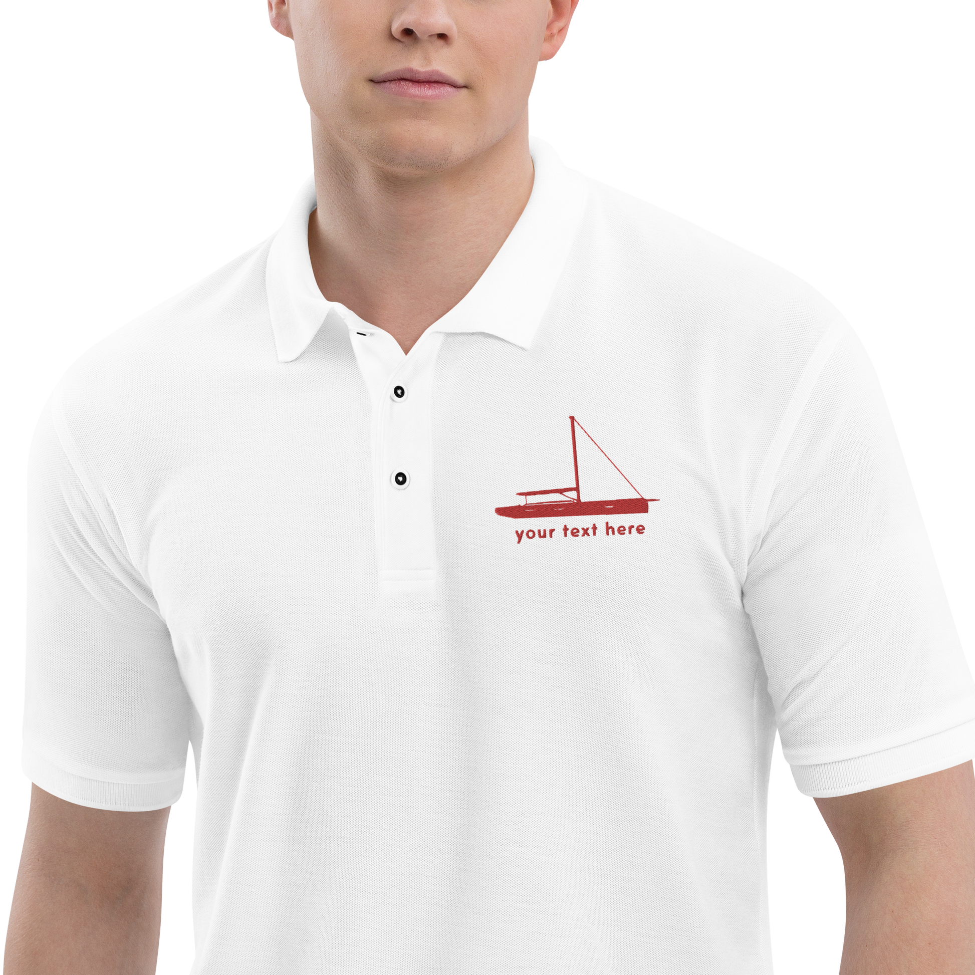 Sailing apparel: White polo shirt with a red sloop rigged sailing boat placed over the left breast.