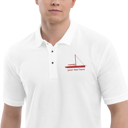 Sailing apparel: White polo shirt with a red sloop rigged sailing boat placed over the left breast.