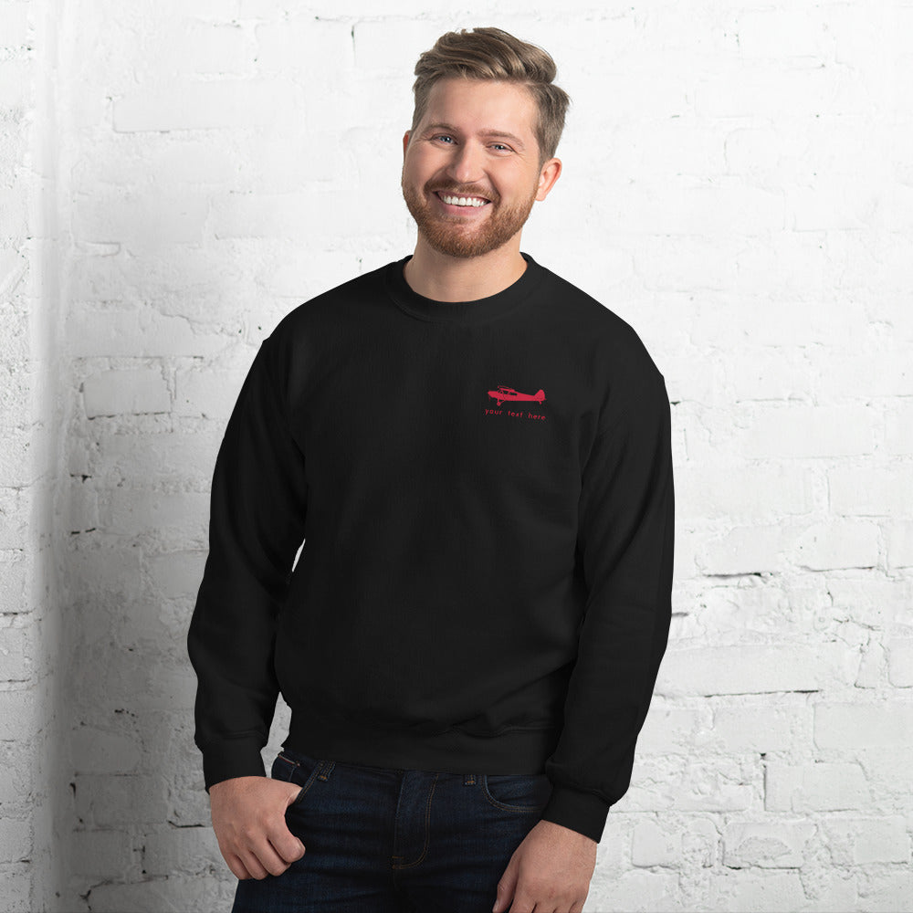 Pilots sweaters: Red Super Cub customizable design positioned on the left breast of a black sweatshirt.