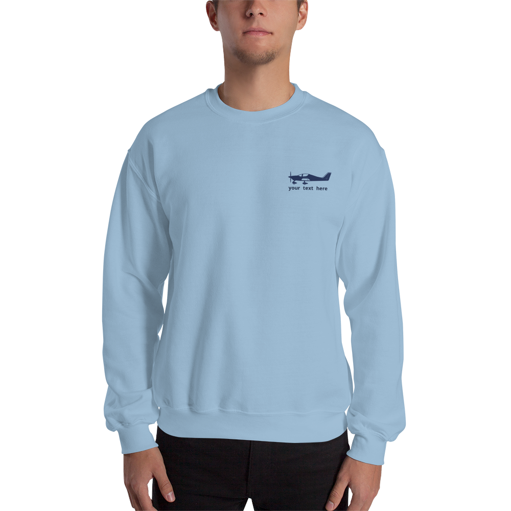 Navy blue Astore aircraft customizable design placed on the left breast of a  light blue sweatshirt