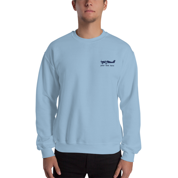 Navy blue Astore aircraft customizable design placed on the left breast of a  light blue sweatshirt