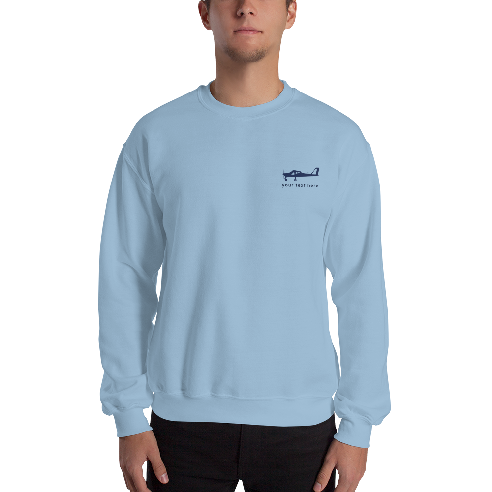 Navy blue Tecnam P92 aircraft customizable design placed on the left breast of a light blue sweatshirt