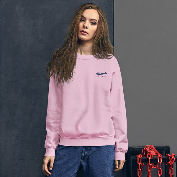 Pilots sweaters: Navy Blue Super Cub customizable design positioned on the left breast on a pink sweatshirt.