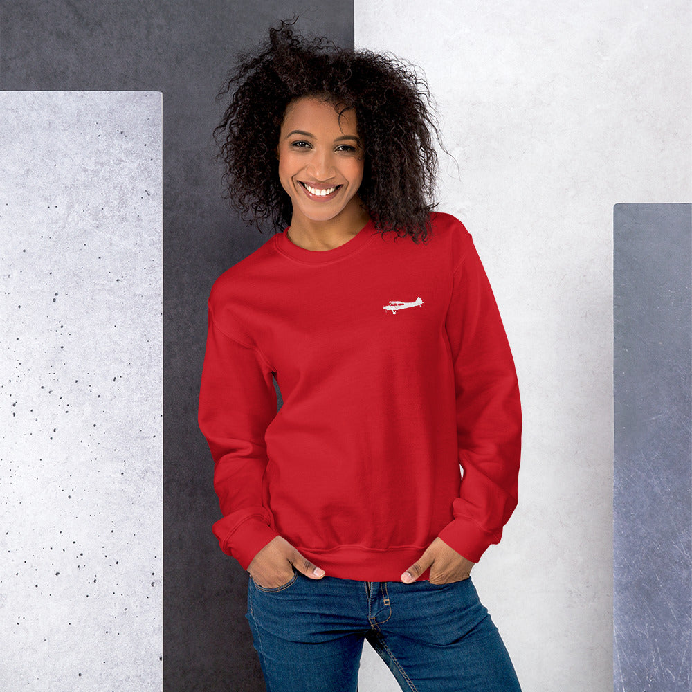 Pilots sweaters: White Super Cub design positioned on the left breast of a red sweatshirt.