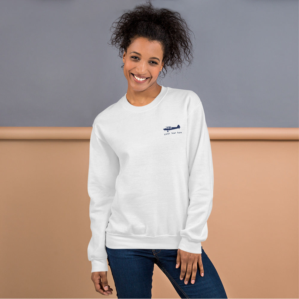 Pilots sweaters: Navy Blue Super Cub customizable design positioned on the left breast on a white sweatshirt.