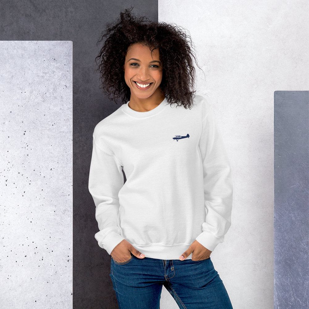 Pilots sweaters: navy blue Super Cub design positioned on the left breast of a white sweatshirt.