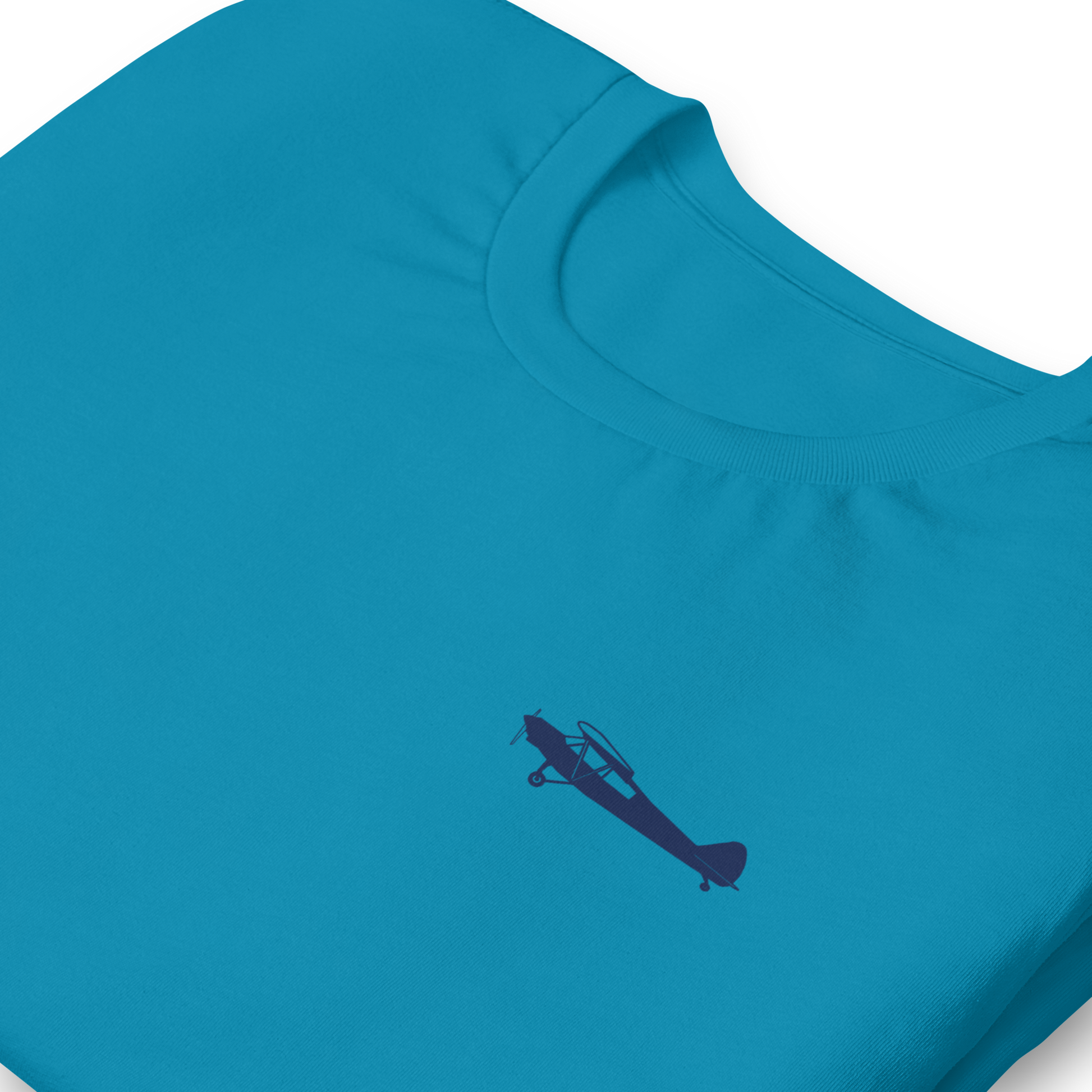 Pilots shirts: Navy blue Super Cub design positioned on the left breast of an aqua  t-shirt.