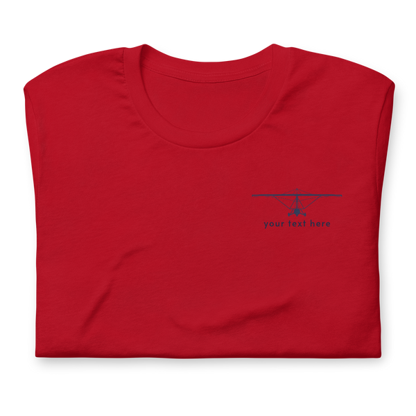 Pilot Shirts: Navy blue customizable weight shift aircraft design placed on the left breast of a red t-shirt.