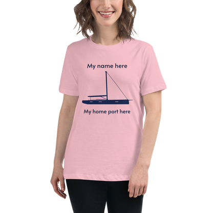 Sailing apparel: womens customizable pink Tee shirt depicting a navy blue 80FT sailing boat with text above the mast stating "My name here," and below the hull "my home port here" for customers to change at will.