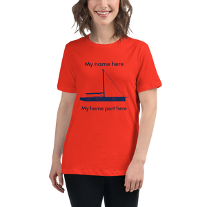 Sailing apparel: womens customizable poppy coloured Tee shirt depicting a navy blue 80FT sailing boat with text above the mast stating "My name here," and below the hull "my home port here" for customers to change at will.